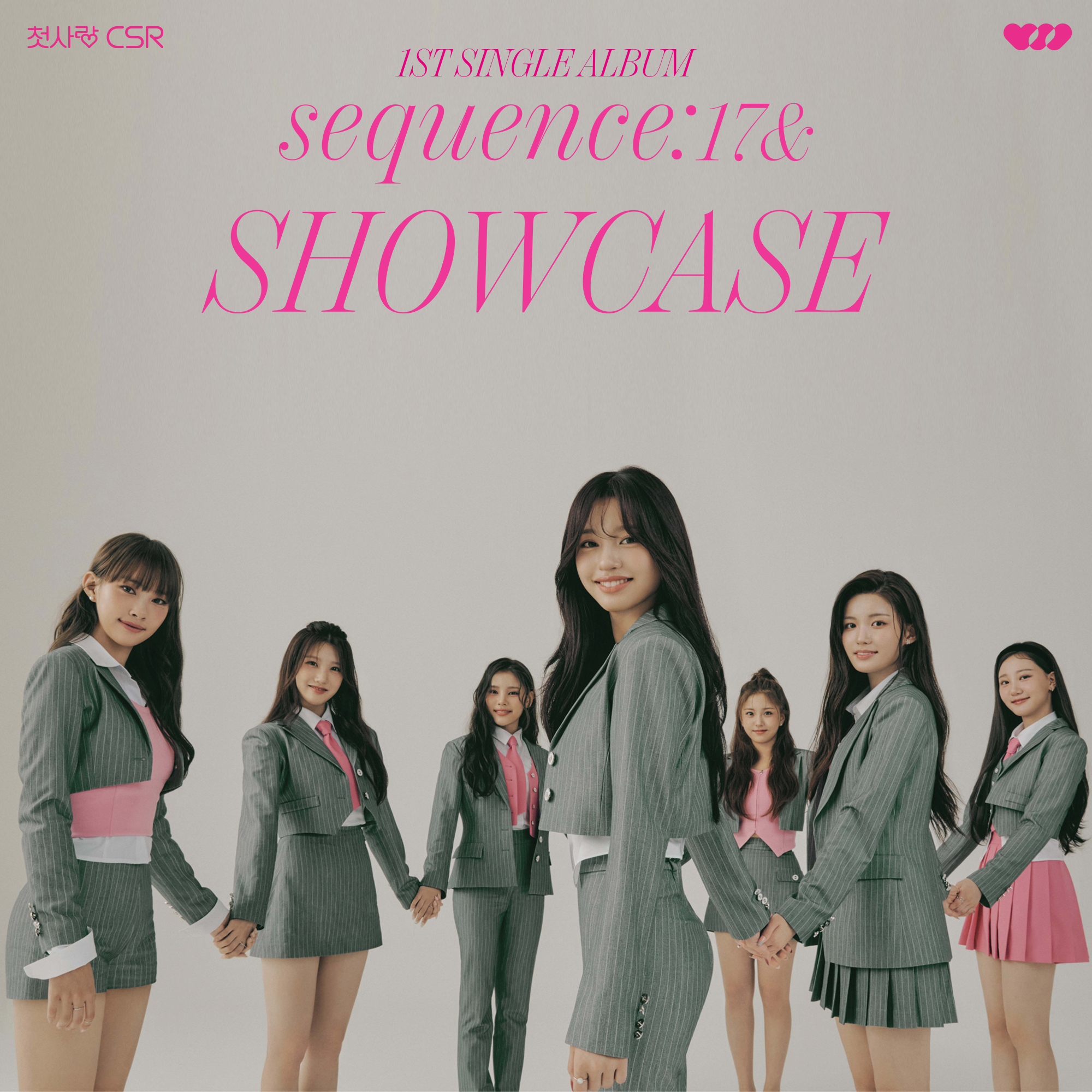 The cover of CSR's first album, Sequence17&. The girls are wearing pink and white outfits with grey blazers. They're smiling while holding hands in front of a grey wall. The name of their album and their group name is written in light pink cursive script